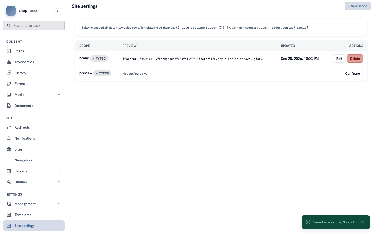 The Site settings list. The brand row shows the saved values and the date, and a green message says Saved site setting "brand"